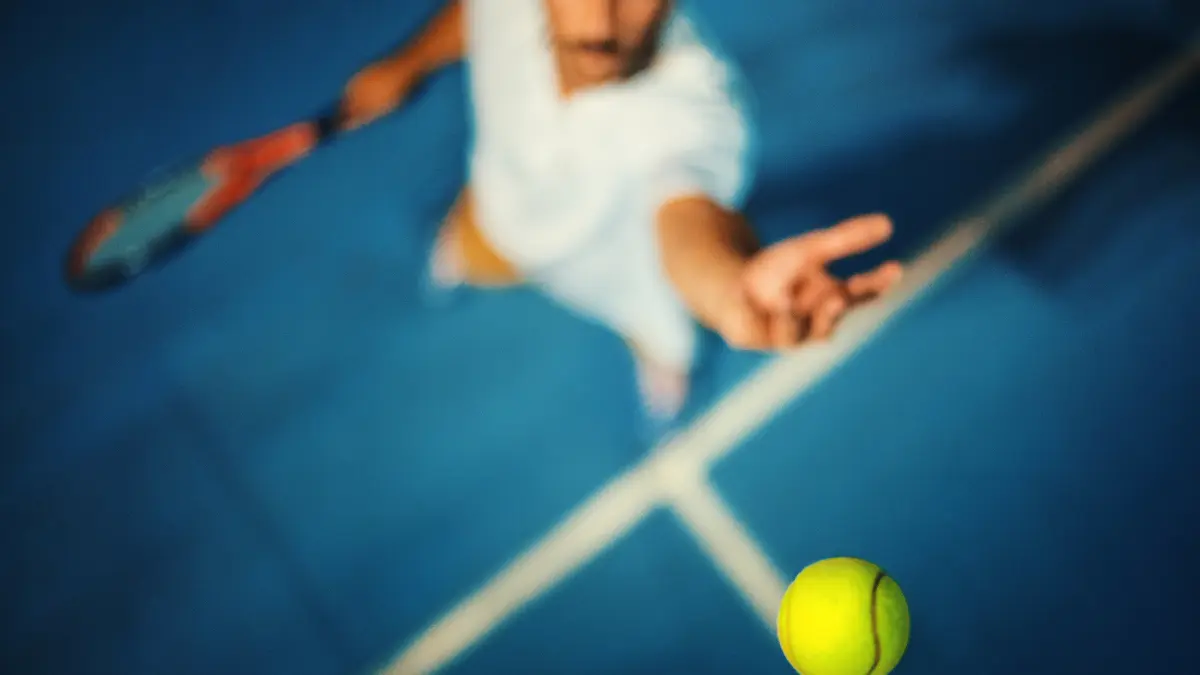 Yellow tennis ball on court contrast line